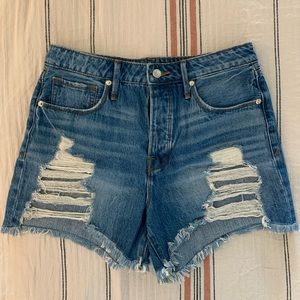 Good American distressed denim shorts